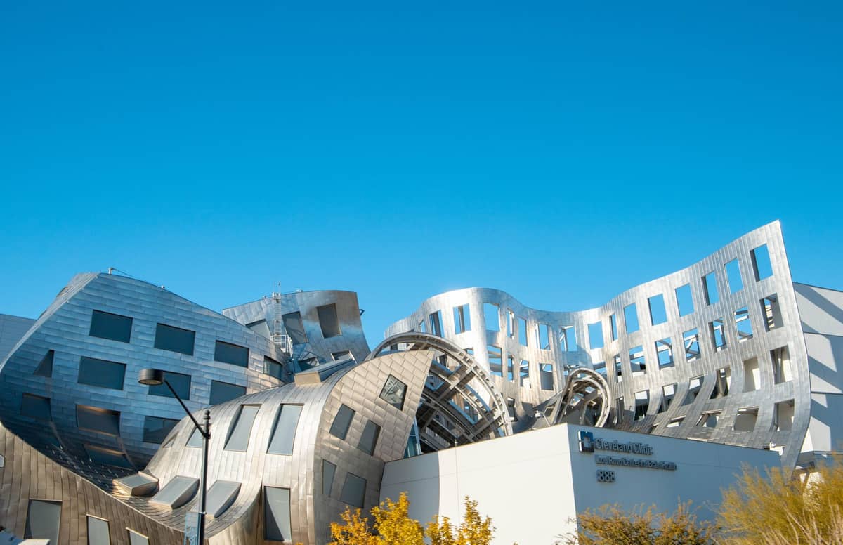 Exterior of the Lou Ruvo Center for Brain Health in Las Vegas, a distinctive silver, undulating architectural landmark that houses the Keep Memory Alive Event Center and regularly hosts science and art exhibits.