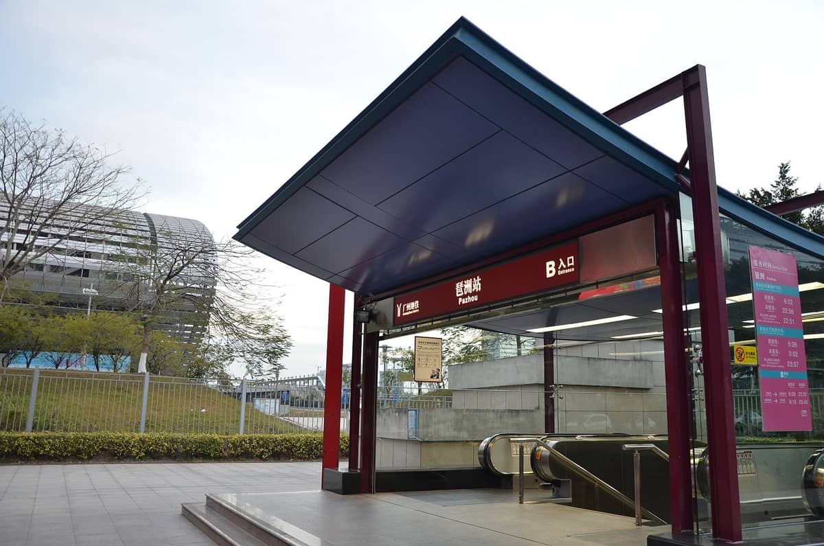 Entrance B of Pazhou metro station in Guangzhou, with signage and the modern convention complex visible in the background.