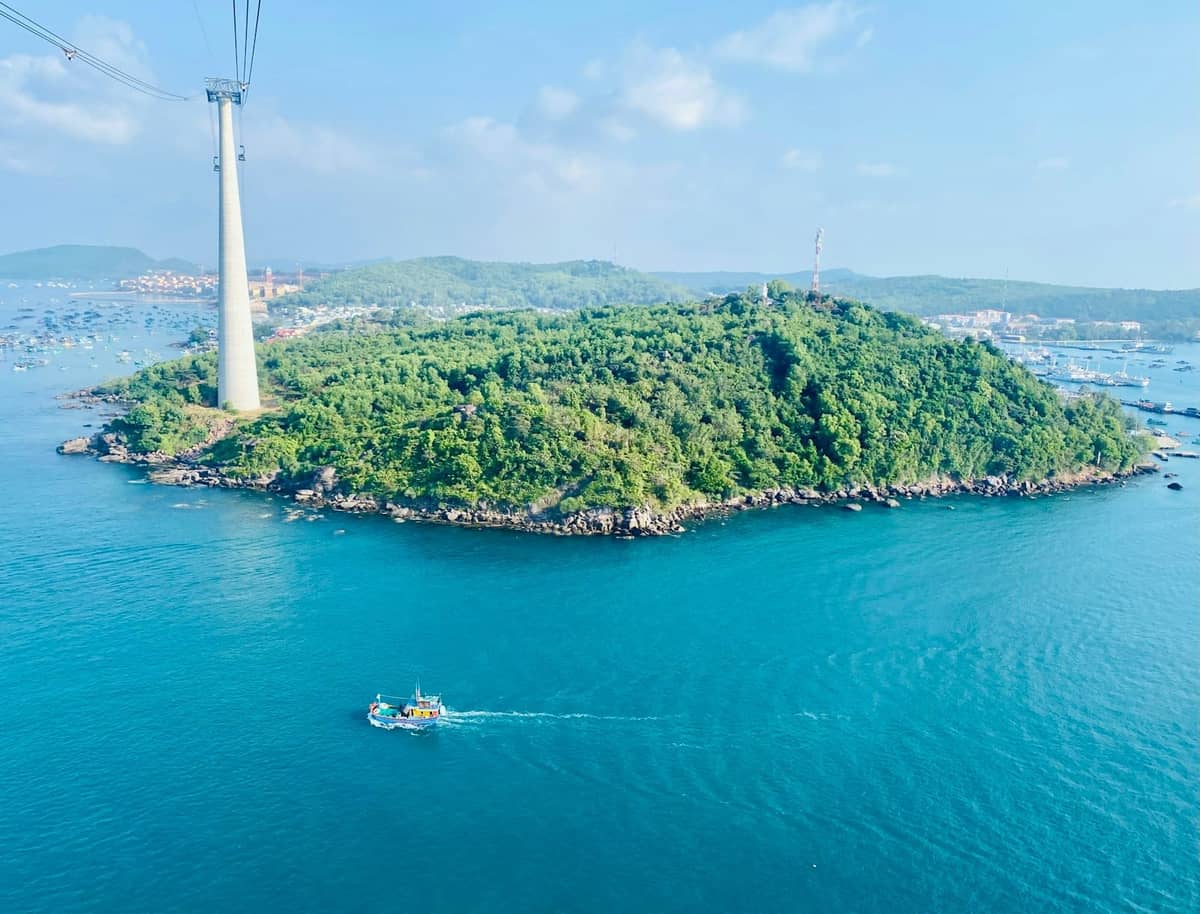 Island off Phu Quoc with Hon Thom cable car tower and calm coastal waters