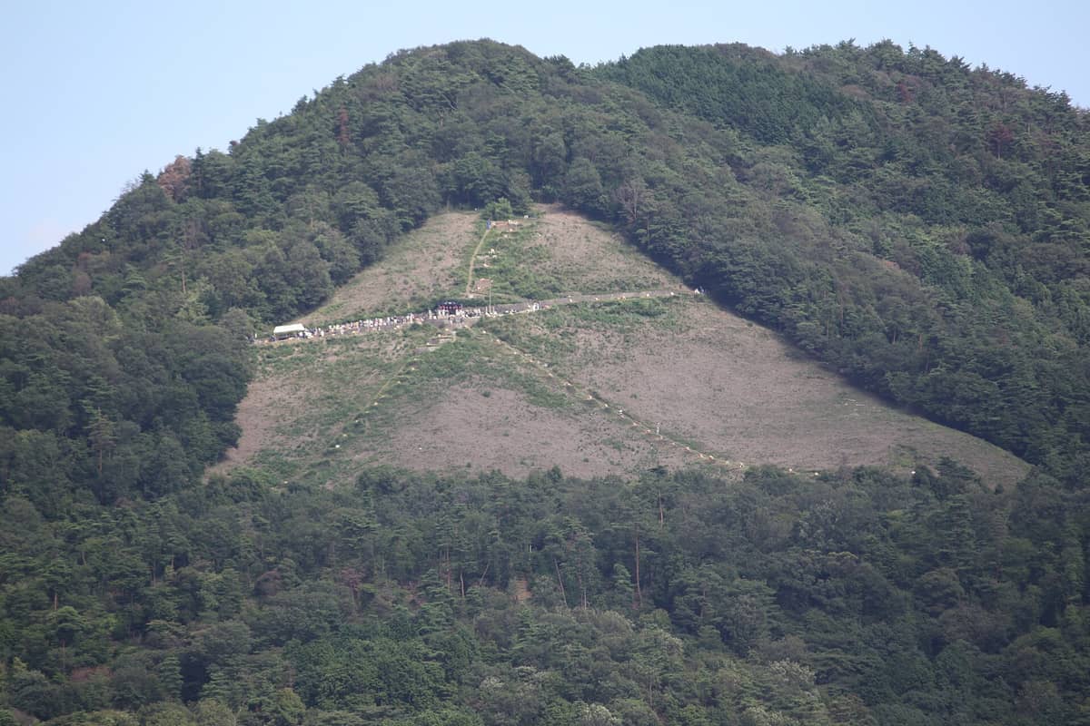 View of Daimonji-yama's iconic hillside, with forested slopes and the clear outline of the famous giant kanji character visible.
