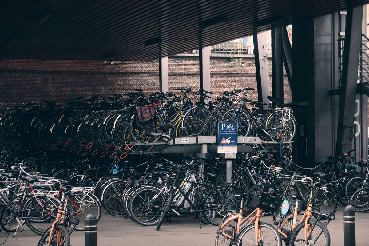 Large covered bicycle parking area filled with many bikes, highlighting cycling culture in a European city.