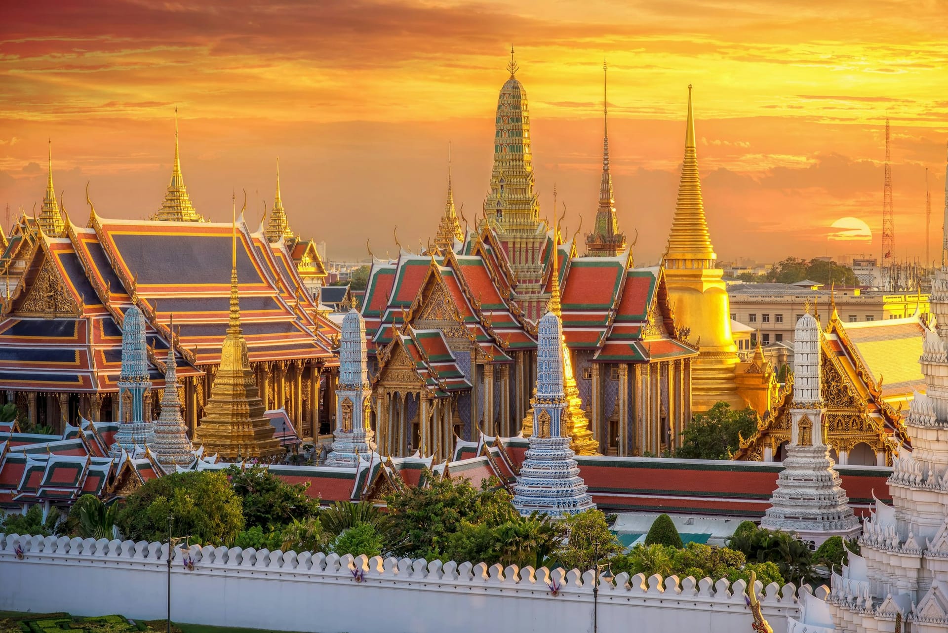 Grand Palace and Wat Phra Kaew temple complex in Bangkok at sunset
