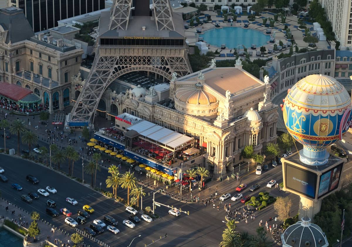 Aerial view of the Las Vegas Strip featuring the Paris Las Vegas Eiffel Tower replica and pool area, perfect for showcasing dayclubs and pool party venues.