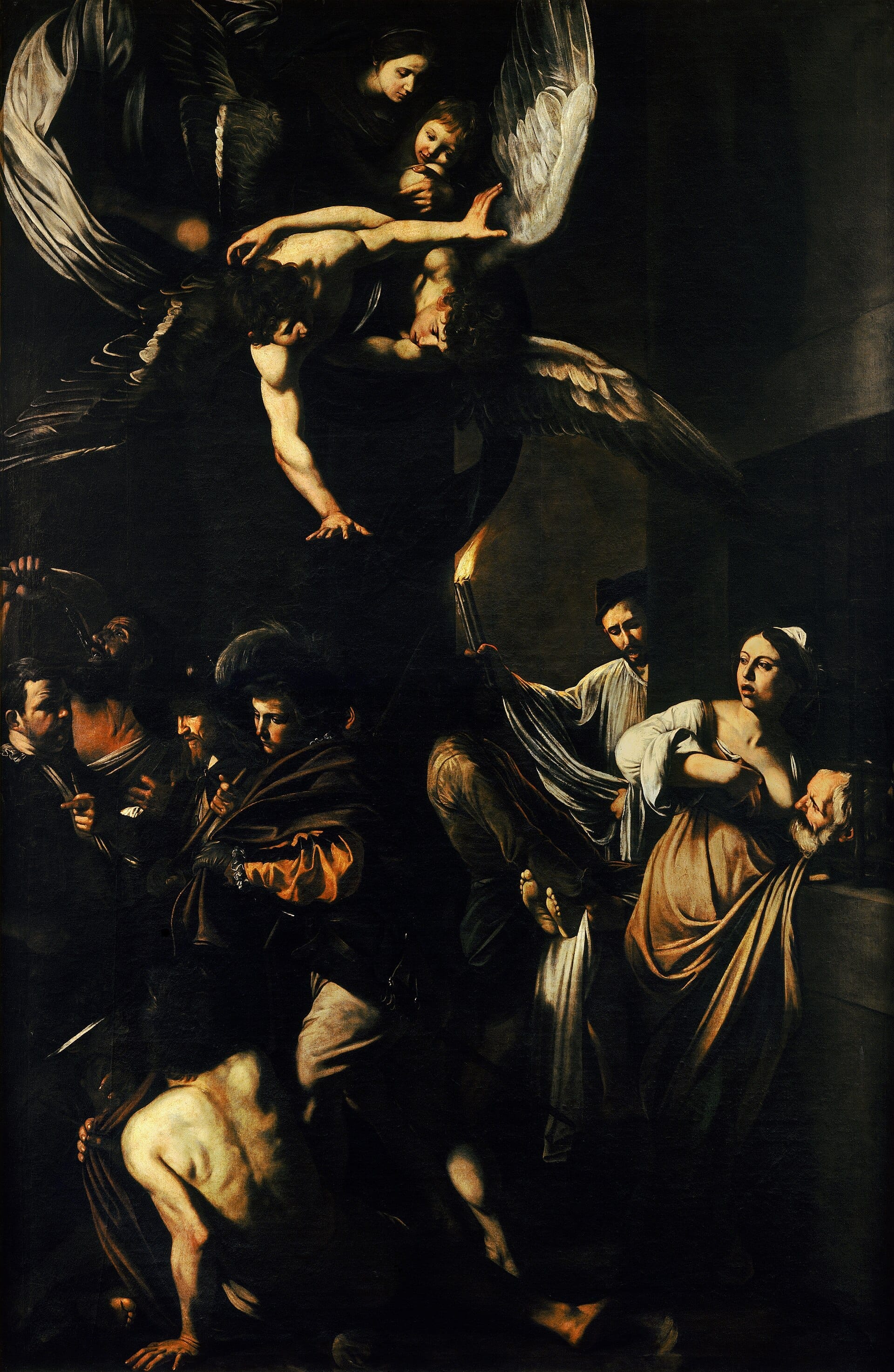 Dramatique peinture baroque représentant de multiples personnages, des anges et d'intenses contrastes de lumière et d'ombre dans les Sept Œuvres de Miséricorde du Caravage à Naples.