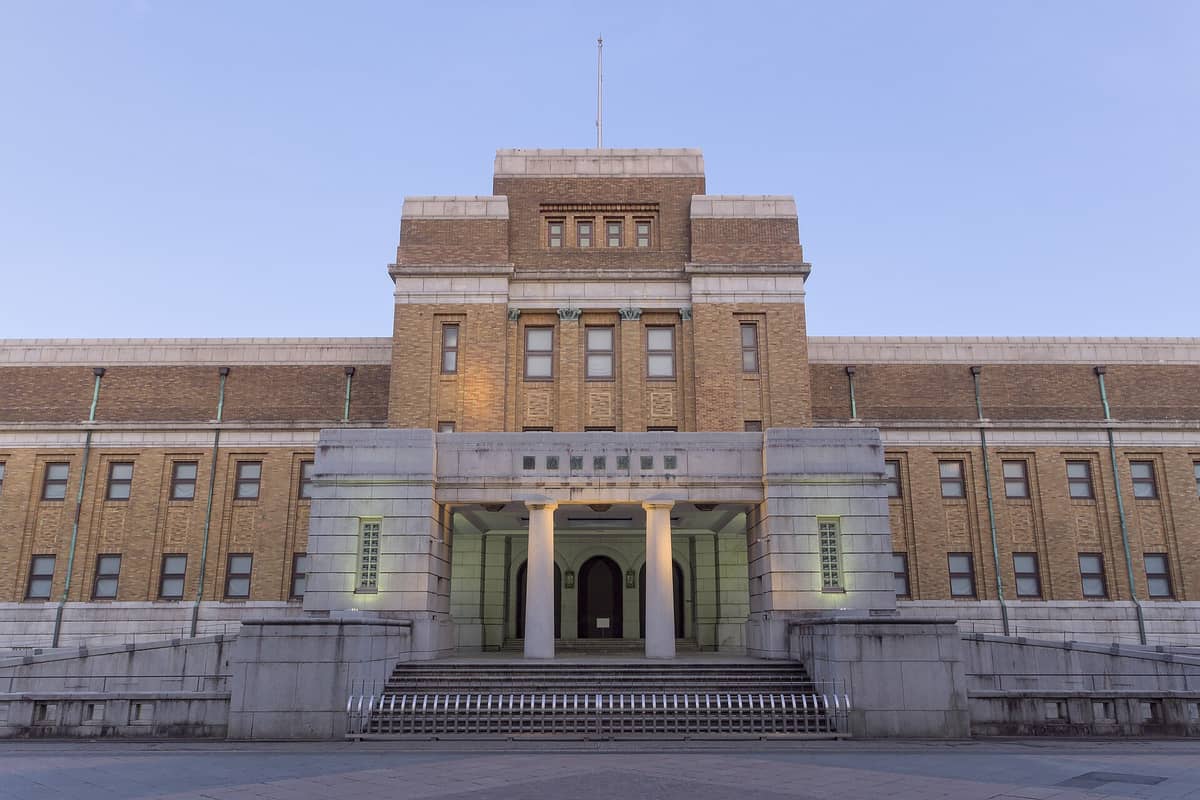 The main entrance of the National Museum of Nature and Science in Ueno, Tokyo, showing its distinctive brick-and-stone façade under a clear sky.
