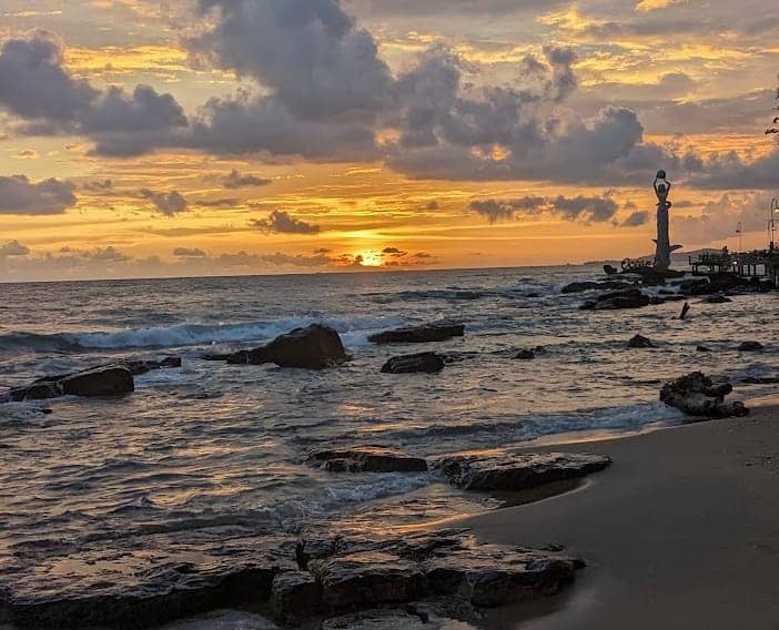 Ong Lang Beach Phu Quoc with rocky shoreline and sunset view over the sea