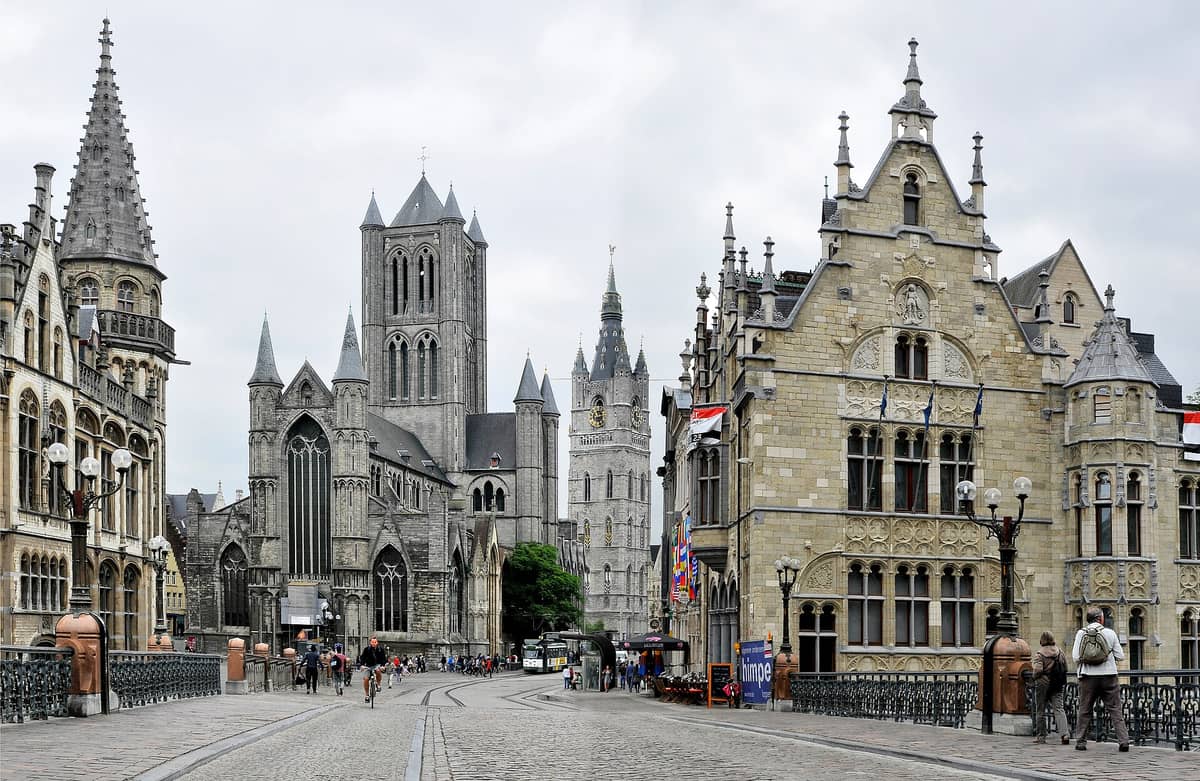 View from St Michael's Bridge in Ghent looking down the street with St Nicholas Church, the Belfry, and St Bavo's Cathedral aligned together.