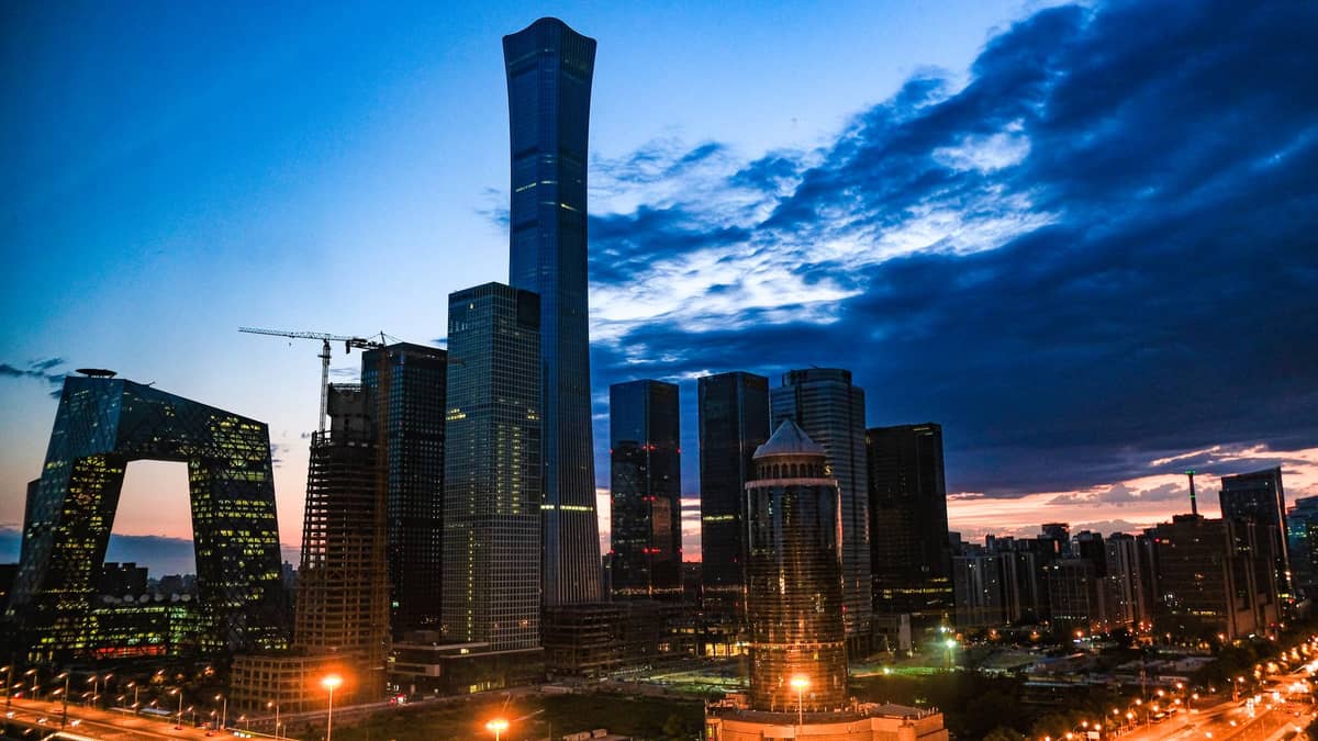 Beijing’s Chaoyang district skyline at dusk, featuring iconic skyscrapers including China Zun and the CCTV Headquarters.