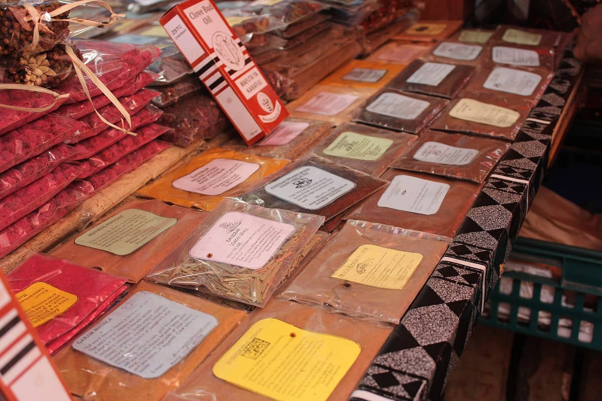 Packets of Zanzibar spices neatly arranged and labeled at a spice market stall, highlighting the island’s culinary diversity and trade influences.